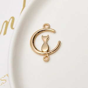 Detailed close-up of golden cat on moon alloy pendant for DIY jewelry accessories