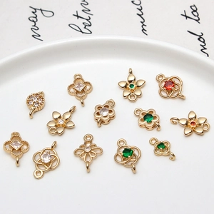 Macro detail of copper zircon vintage hollow flower pendants for DIY jewelry making