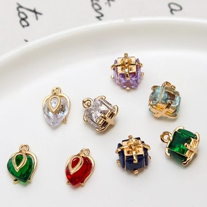 Colorful copper pendants set with faceted zircon in teardrop and cube shapes for DIY jewelry