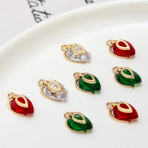 Macro shot of faceted teardrop crystal charms in gold setting for DIY jewelry making