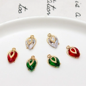 Detail of copper cubic zirconia flower bud and teardrop charms for DIY jewelry making