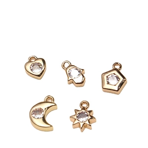 Golden DIY charms set with zircon inlays featuring heart moon and sun shapes