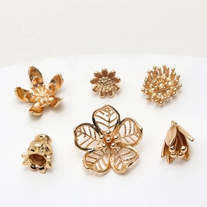 Macro view of detailed golden brass flower petals and floral jewelry DIY components