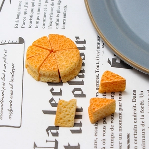 Macro detail of miniature resin cheese slices with realistic honeycomb texture for DIY crafts