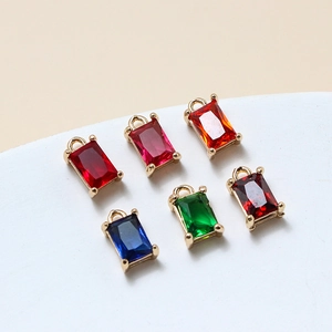 Detailed view of six colorful rectangular glass crystal pendants with gold claw settings