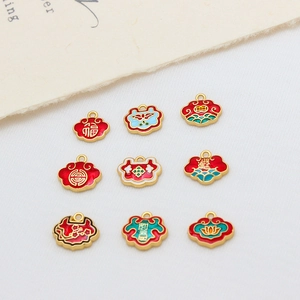 Macro detail of nine traditional Chinese Ruyi lock pendants with enamel floral patterns