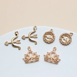 DIY jewelry charms set featuring zircon heart, crown and shell pendants in gold plating