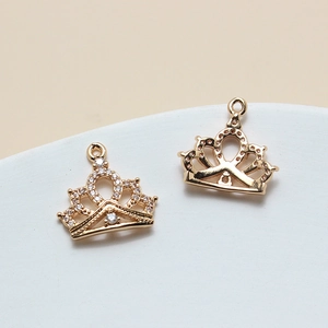 Macro shot of cubic zirconia paved crown charms for DIY jewelry making with front and back view