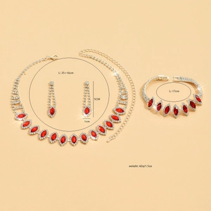Sparkling bridal jewelry set with red teardrop crystals and necklace, bracelet and earrings