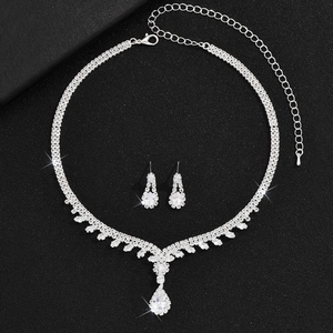 Elegant silver bridal jewelry set with sparkling crystals and pear-shaped pearl necklace
