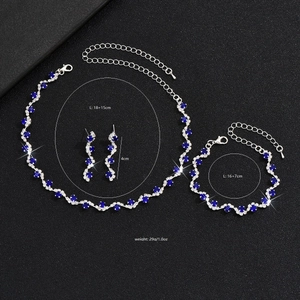 Silver plated bridal jewelry set with navy blue rhinestones, necklace, bracelet, and earrings