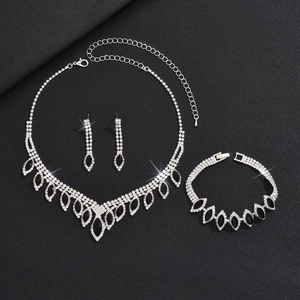 Macro shot of silver jewelry set with black marquise stones and white diamonds