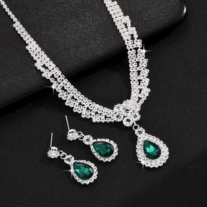Elegant silver jewelry set with emerald green pear-cut crystals and necklace