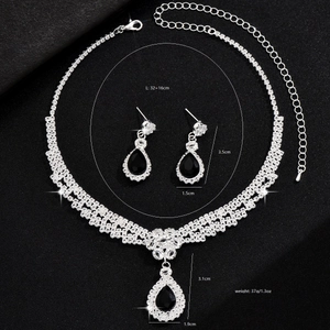 Elegant necklace and earring set with black teardrop crystals and silver-tone rhinestones