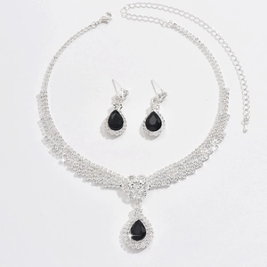Elegant necklace and earrings set with black pear-shaped crystals and sparkling rhinestones