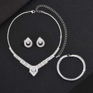 Elegant bridal rhinestone jewelry set with pear-cut necklace earrings and bracelet