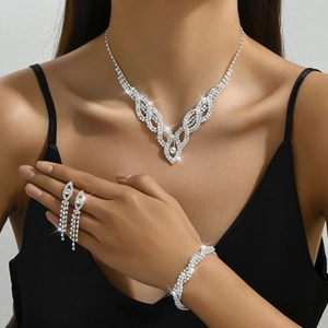 Detailed close-up of bridal jewelry set with hollow silver crystals on elegant model