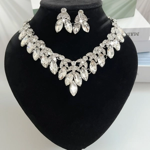 Sparkling bridal jewelry set featuring hollow crystal leaf necklace and matching earrings