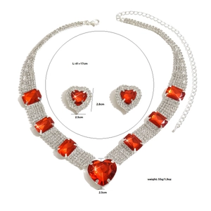 Detail showing heart-shaped red gemstones and crystal encrusted silver necklace set