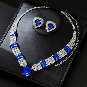 Elegant silver jewelry set with sapphire heart pendant and matching earrings in gift box