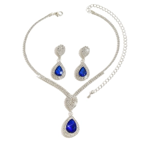 Elegant silver-tone jewelry set with navy blue teardrop gemstones and crystals