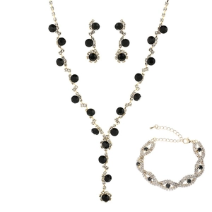 Three-piece bridal jewelry set with black stones and sparkling crystals in gold finish