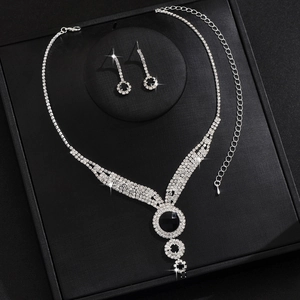 Exaggerated silver bridal jewelry set with black round stones and sparkling rhinestones