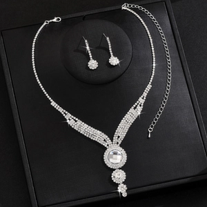 Macro view of bridal jewelry set with silver rhinestones and necklace detail in a box