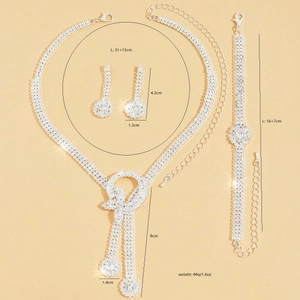 Sparkling rhinestone bow jewelry set with tassel necklace, earrings, and bracelet