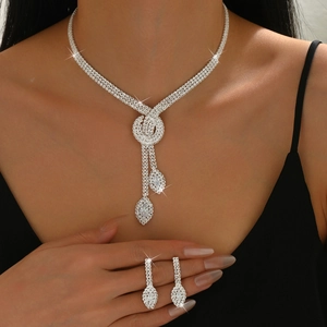 Elegant silver bridal jewelry set with sparkling crystal necklace and drop earrings