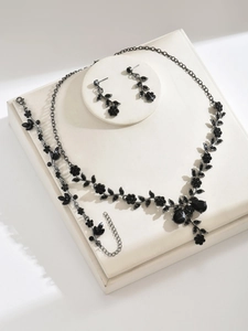 Detail view of gothic black rhinestone crystal necklace earrings and bracelet jewelry set