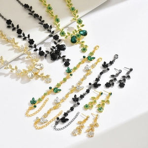 Sparkling crystal necklace earrings and bracelet bridal jewelry set with floral vine design