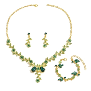 Golden bridal jewelry set with emerald green crystals including necklace and earrings