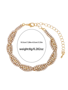 Close-up of sparkling rhinestone pavé bracelet with gold-tone extension chain and clasp