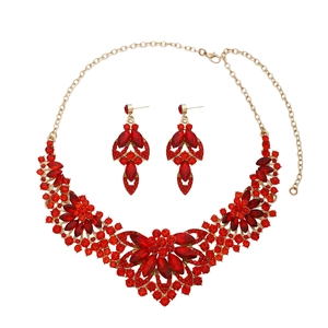 Luxury gold-plated jewelry set with sparkling red crystals and matching earrings