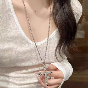 Gothic punk long cross necklace with white sparkling zircons worn by model