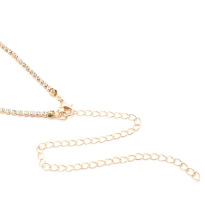 Detail of golden rhinestone waist chain featuring a lobster clasp and extension links