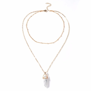 Close-up of double-layer gold chain necklace with white marble hexagonal stone pendant