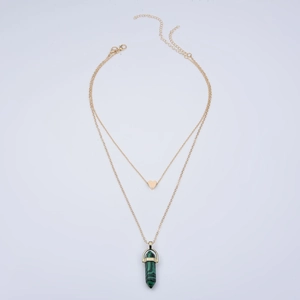 Double-layered gold necklace featuring a heart pendant and green hexagonal stone pillar