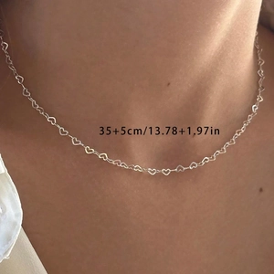 Close-up of minimalist silver hollow heart chain bracelet with 35+5cm length detail
