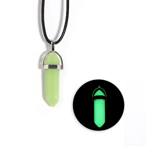 Luminous hexagonal crystal pendant with black leather cord and green glow detail