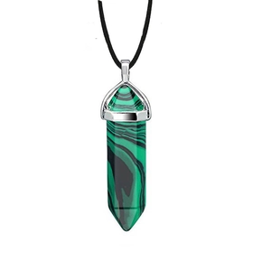 Detail of hexagonal malachite crystal pendant with silver clasp on black cord necklace