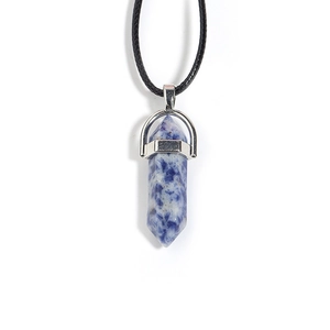 Detailed close-up of blue marble hexagonal column pendant with silver metal bail on black cord