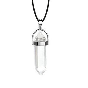 Macro shot of a clear hexagonal crystal pendant with a sleek black cord necklace