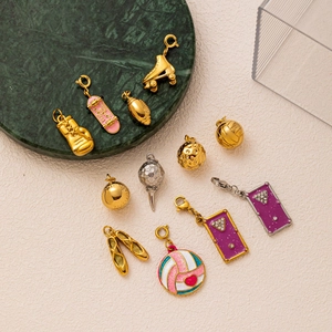 18K gold plated stainless steel sports charms including skates and boxing gloves