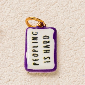 Rectangle enamel charm with Peopling Is Hard text in purple and 18K gold plating
