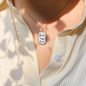 18K gold plated necklace with ceramic rectangle pendant featuring faith hope love script