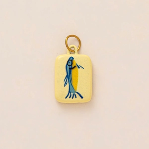 Oval tomato flower pendant in cream yellow with blue fish pattern and 14K gold plated loop