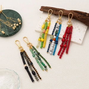Detailed set of bohemian beaded keychains featuring natural stones and gold lobster clasps
