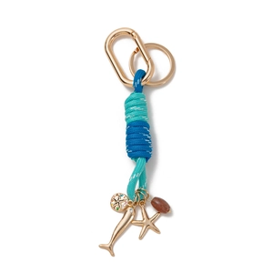 Close-up of ocean-themed charm keychain with starfish, dolphin, and braided cord